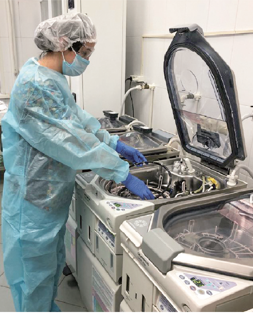 Staff doing endoscopy cleaning